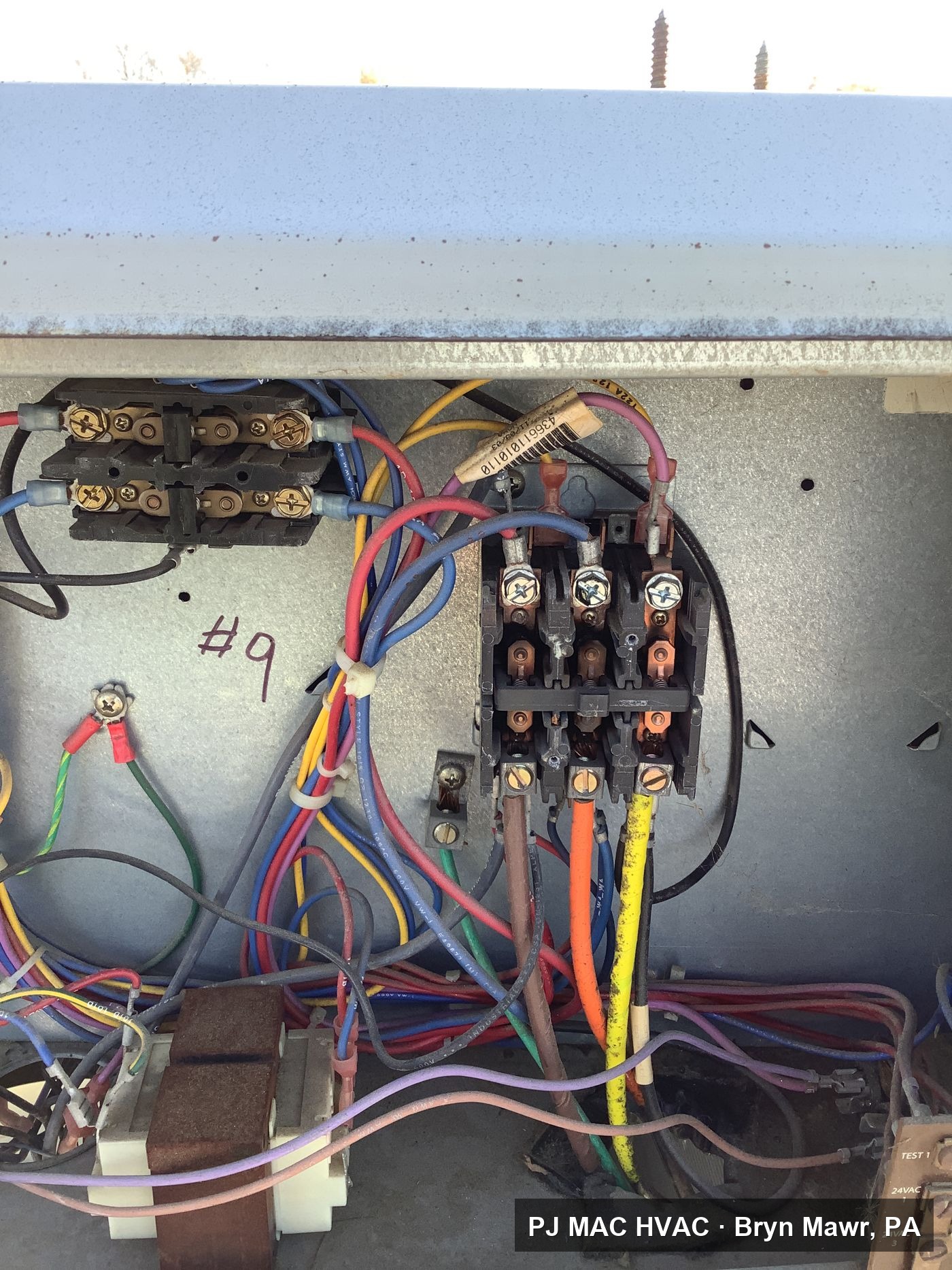 Control wiring work inside an HVAC electrical compartment