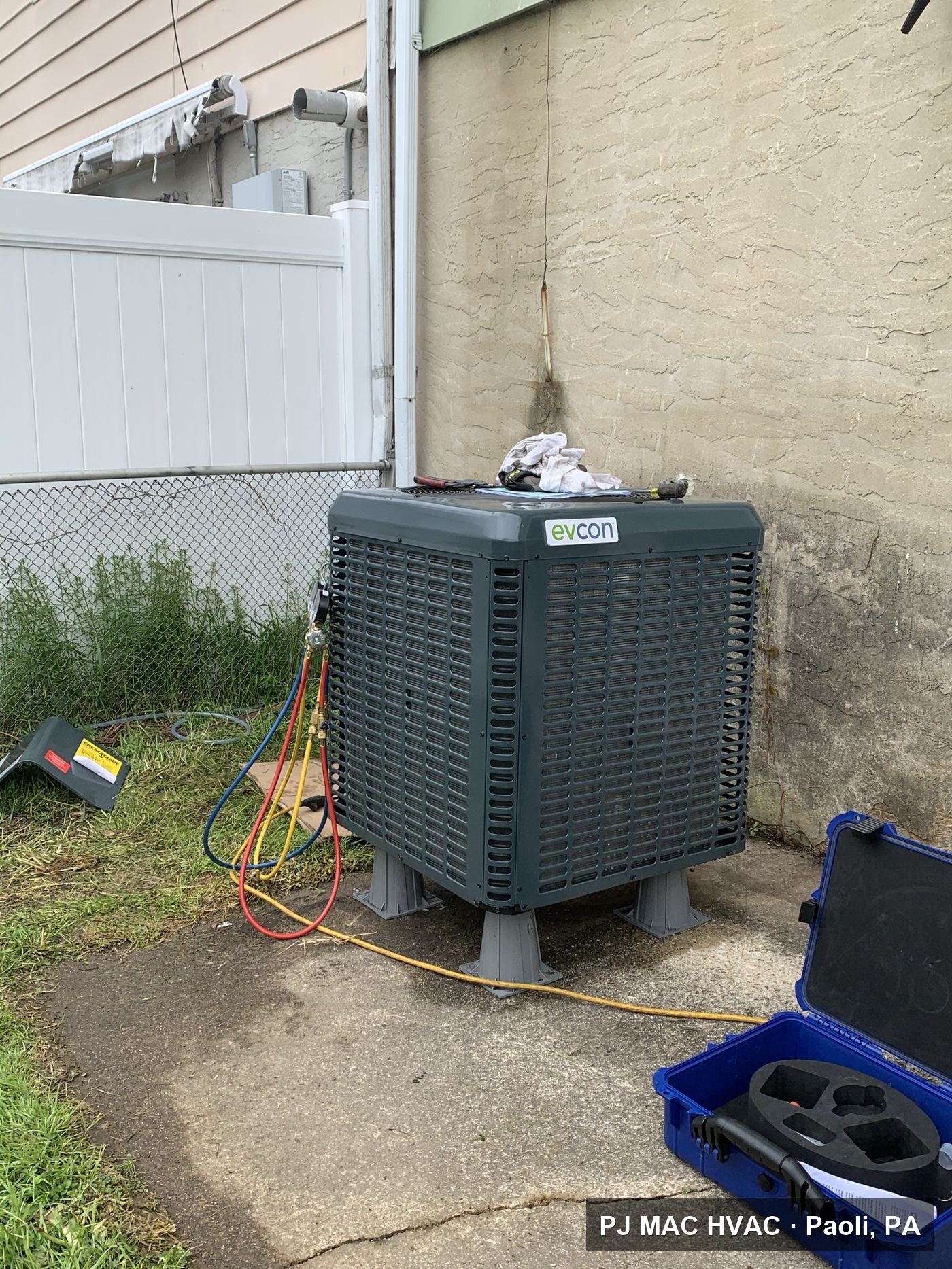 PJ MAC HVAC commissions a new Evcon air conditioning condenser outside a Philadelphia-area home.