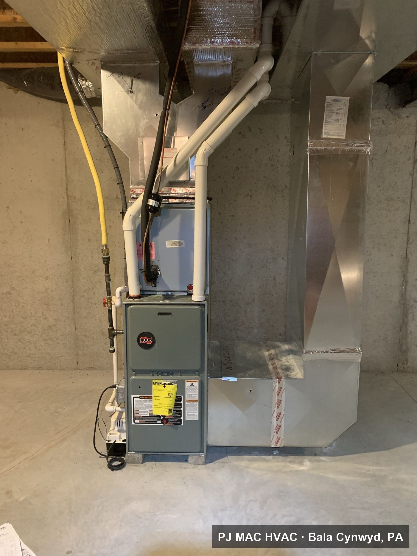 New Ruud high-efficiency gas furnace installed in a basement